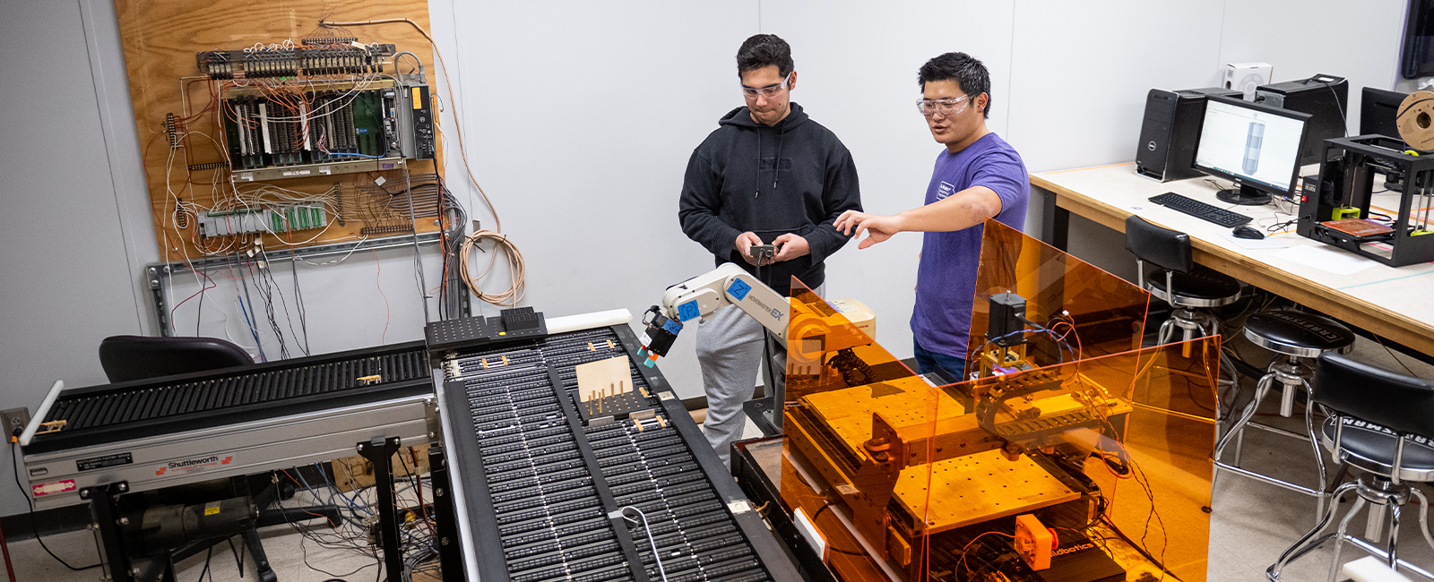 Two students work in a lab.